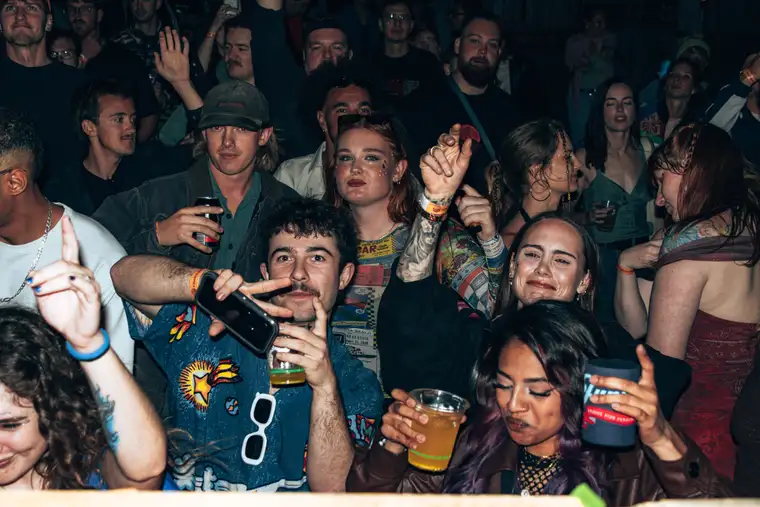 The crowd, hands up, mid set.