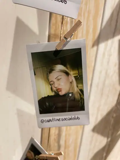 A polaroid from the stand, pegged on the line.