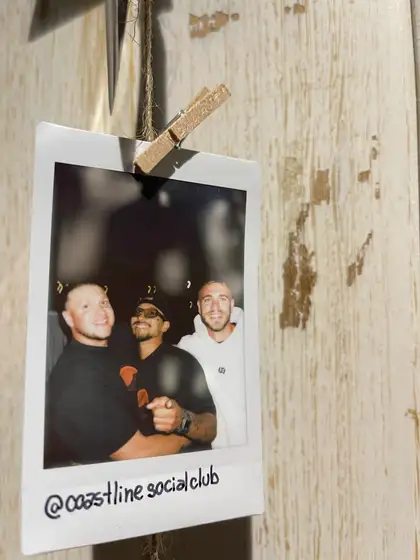 A polaroid from the stand, pegged on the line.