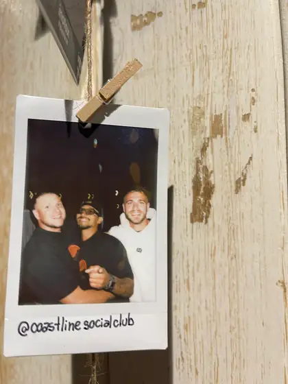 A polaroid from the stand, pegged on the line.