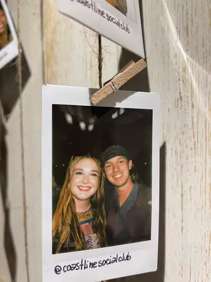 A polaroid from the stand, pegged on the line.