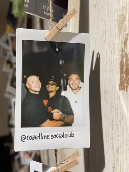 A polaroid from the stand, pegged on the line.